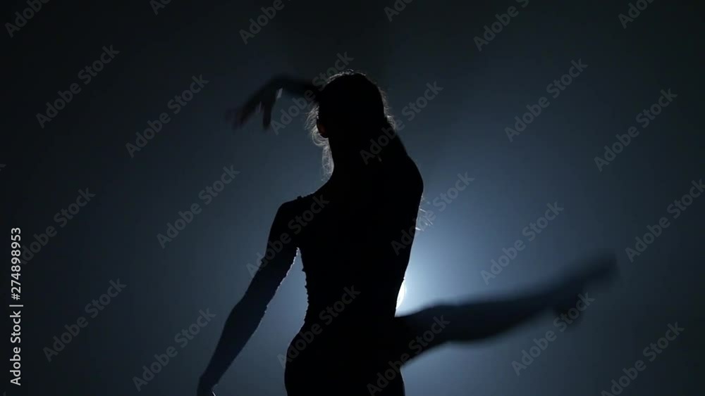 Slow motion of silhouettes dancing ballerina. Close-up Slow motion of silhouettes dancing ballerina. Close-up