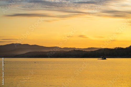 Wide-angle lake in the morning, sunrise after the mountain