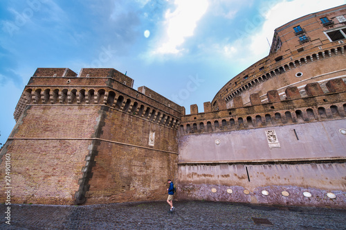 ROME, ITALY - JUNE 2014: Tourists visit Saint Angel Castle. The city attracts 15 million people annually photo