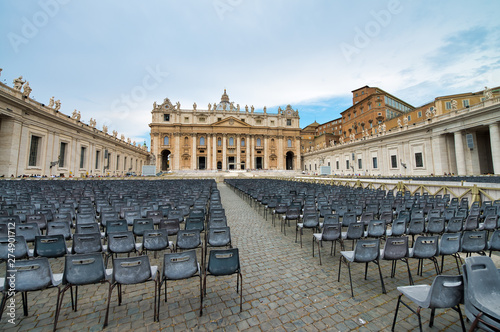 ROME, ITALY - JUNE 2014: Tourists visit St Peter Square in Vatican. The city attracts 15 million people annually