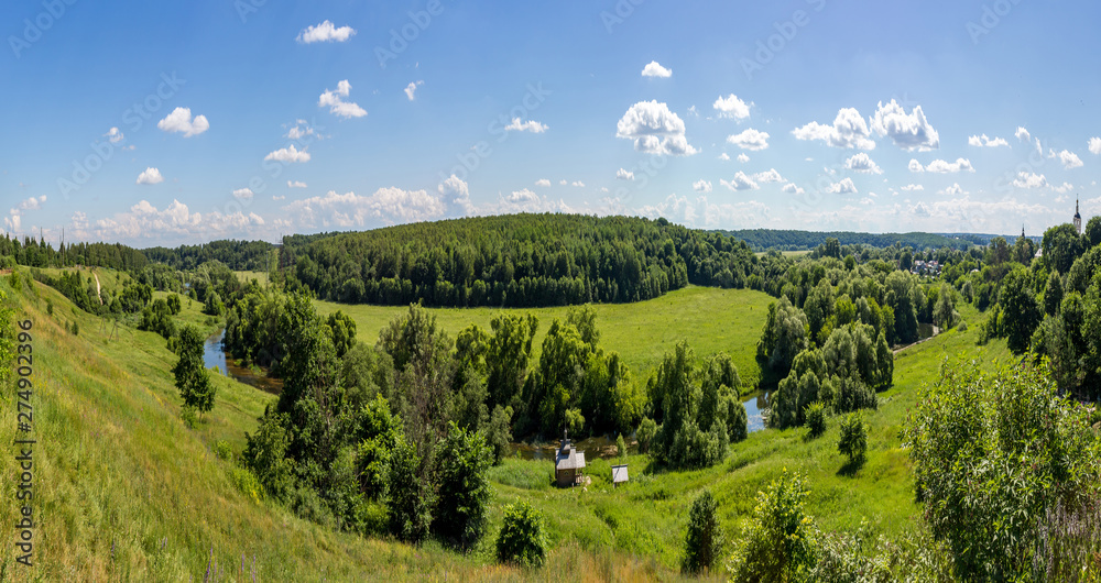 Panoramic view of the green valley of the river Protva from the village Ryabushki, Borovsk city, Kaluzhskiy region, Russia. June 2019