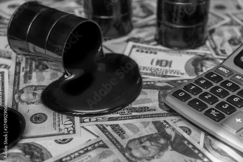 barrels of oil, calculator on the background of American dollars. market, the sale of oil.