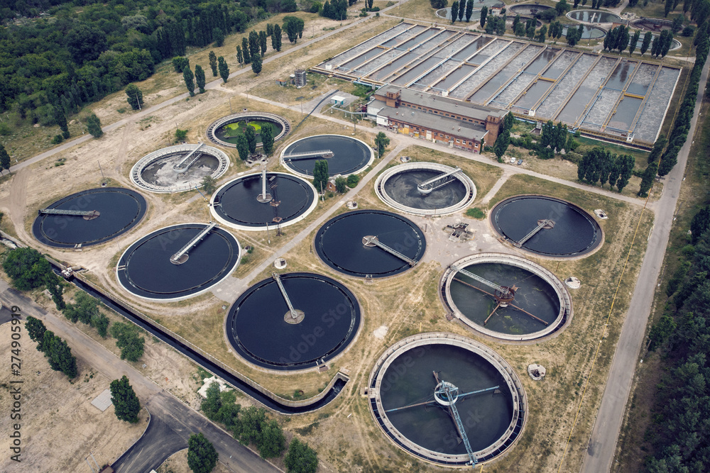 Modern urban wastewater and sewage treatment plant with aeration tanks, industrial water recycling and purification, aerial view