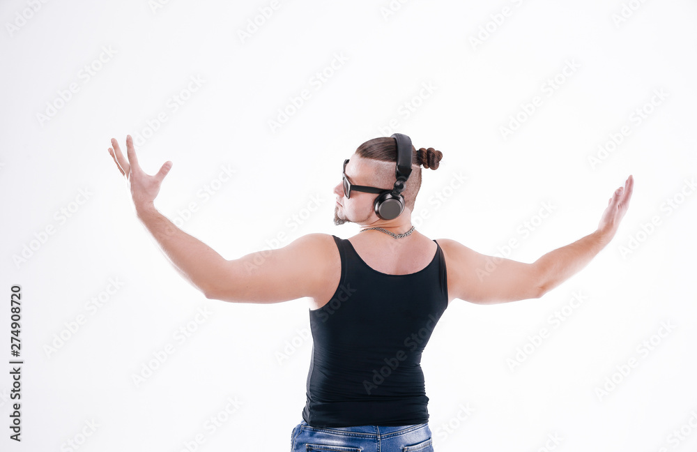 rear view.stylish DJ-rapper, looking at copy space.isolated on white rear view.stylish DJ-rapper, looking at copy space.isolated on white