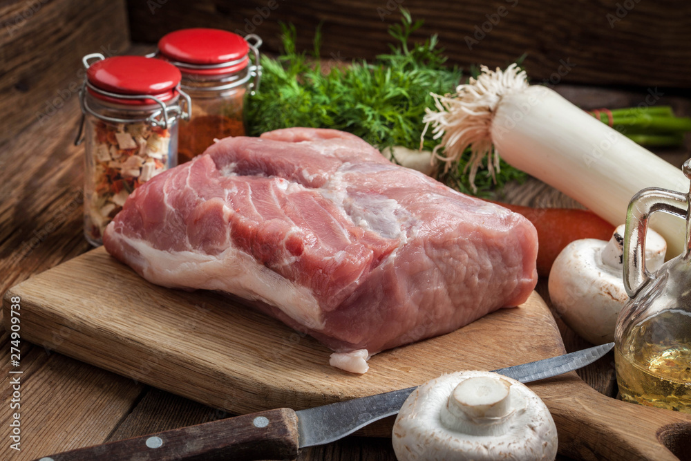 Raw loin on a chopping board. Raw loin on a chopping board.