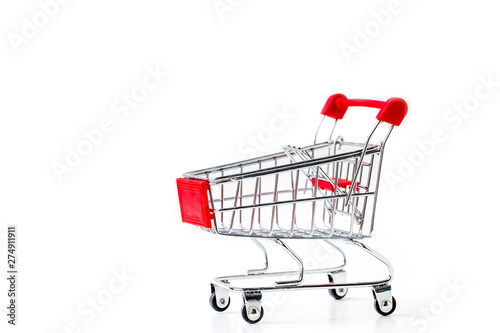 Miniature shopping cart isolated on white background.