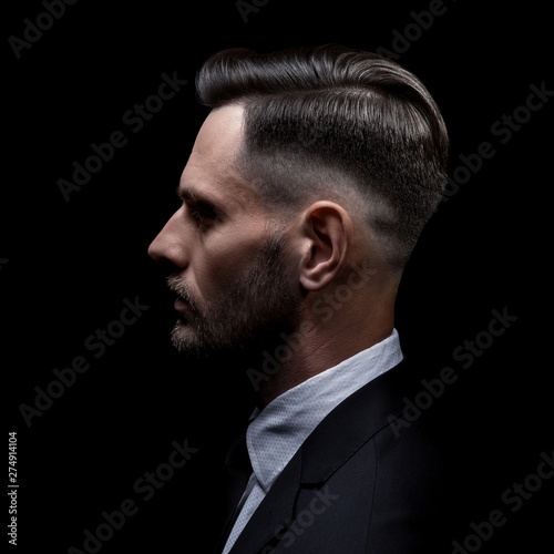Men's hairstyle. Side portrait of a man