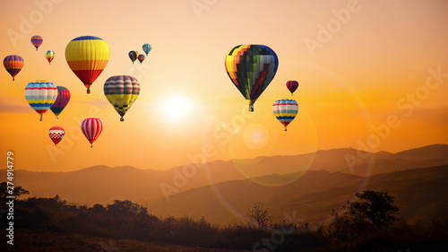 Hot air balloon above high mountain at sunset © applezoomzoom