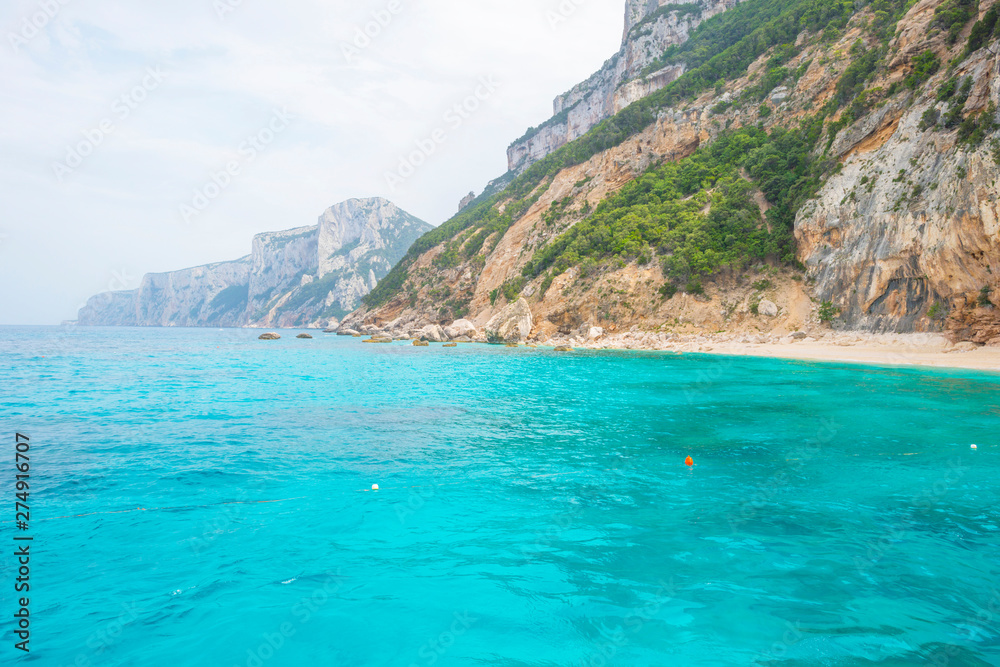 Rocky coast of the island of Sardinia in the Mediterranean Sea viewed from a boat Rocky coast of the island of Sardinia in the Mediterranean Sea viewed from a boat