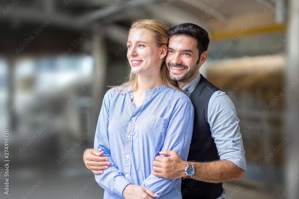 Smiling Couple Standing Outdoors Smiling Couple Standing Outdoors