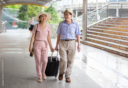 elderly couple traveler in city