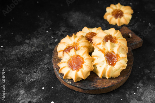 Cookies with apricot jam on a dark background