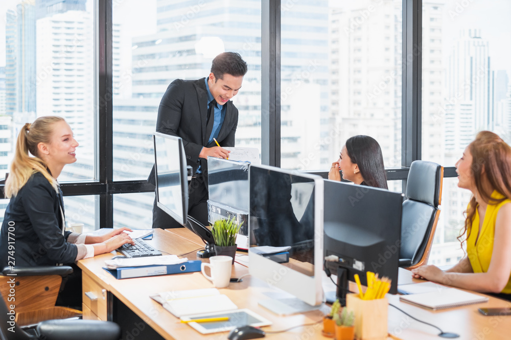 Group of Asian business people working and meeting/discussing at office