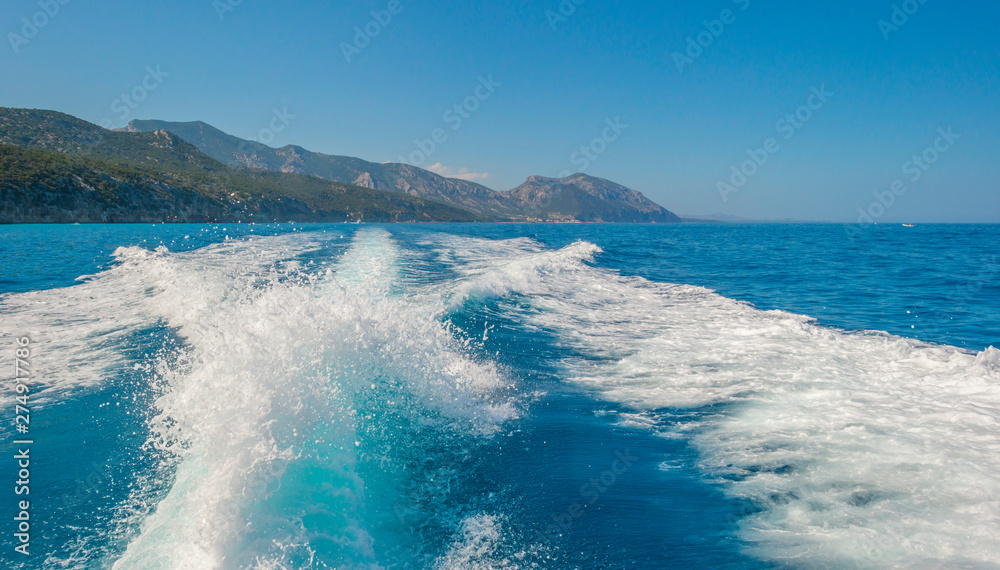 Rocky coast of the island of Sardinia in the Mediterranean Sea viewed from a boat