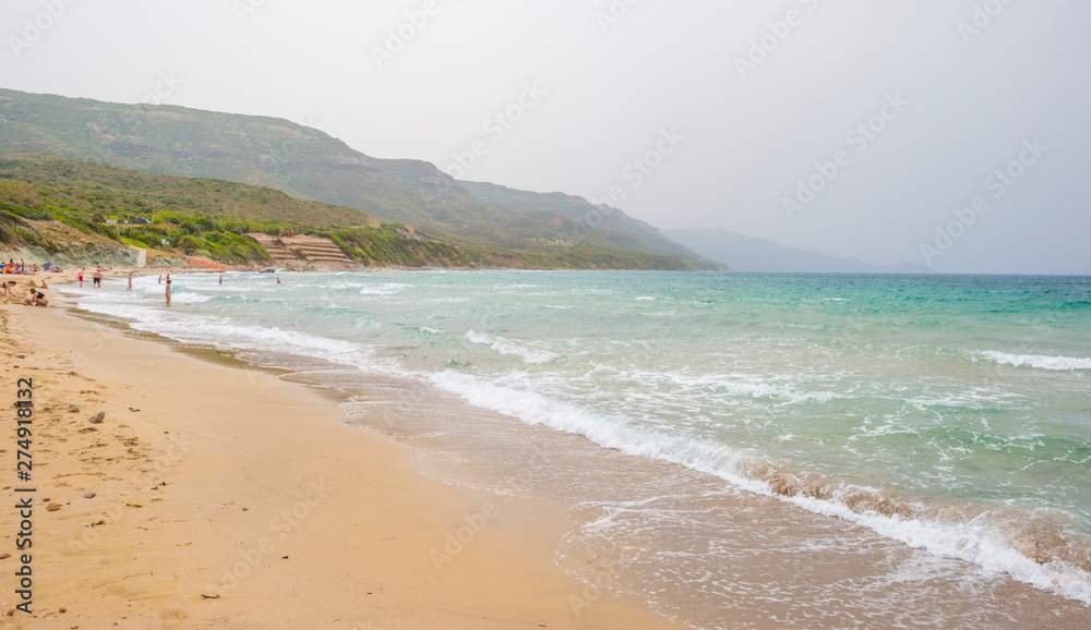 Rocky coast of the island of Sardinia in the Mediterranean Sea viewed from a boat Rocky coast of the island of Sardinia in the Mediterranean Sea viewed from a boat
