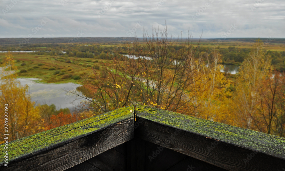 Fototapeta premium An old wooden fortress with high walls and a water ditch