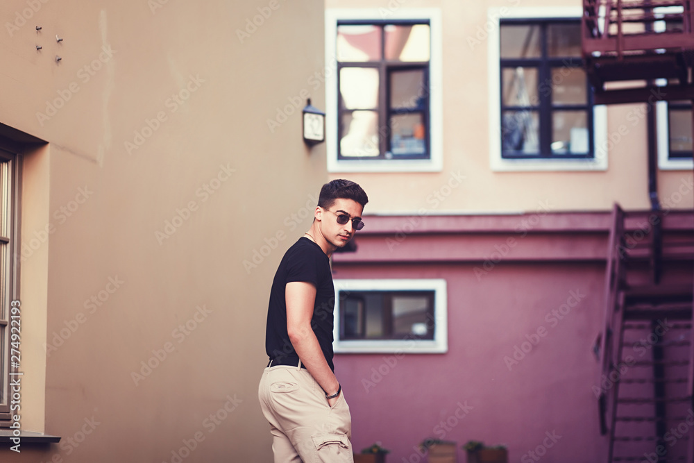 handsome male model with wearing black t-shirt in casual urban style handsome male model with wearing black t-shirt in casual urban style