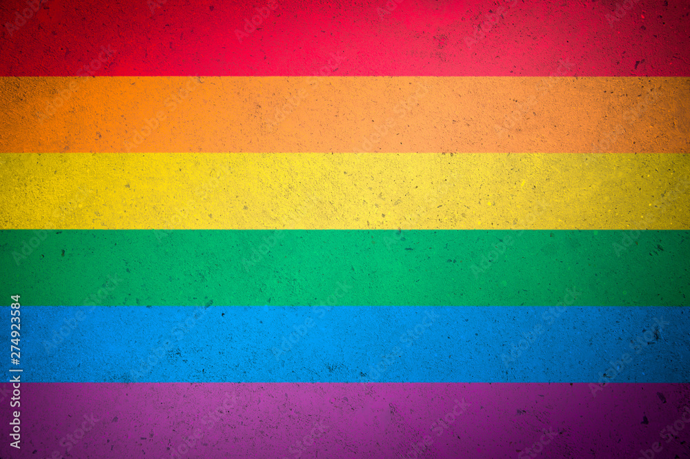 Gay pride background of rainbow colors painted on full frame of textured wood