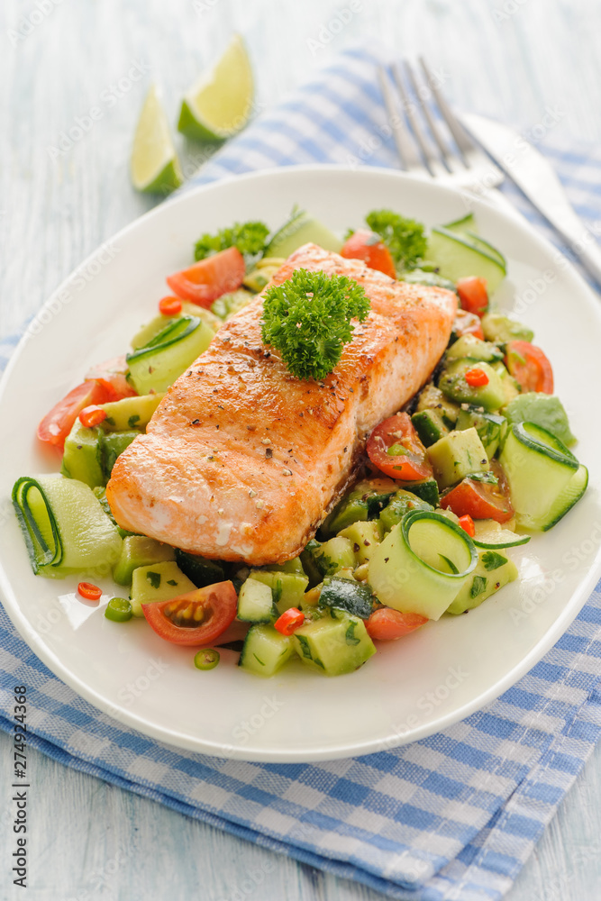 Grilled salmon fillet with vegetable salad. Grilled salmon fillet with vegetable salad.