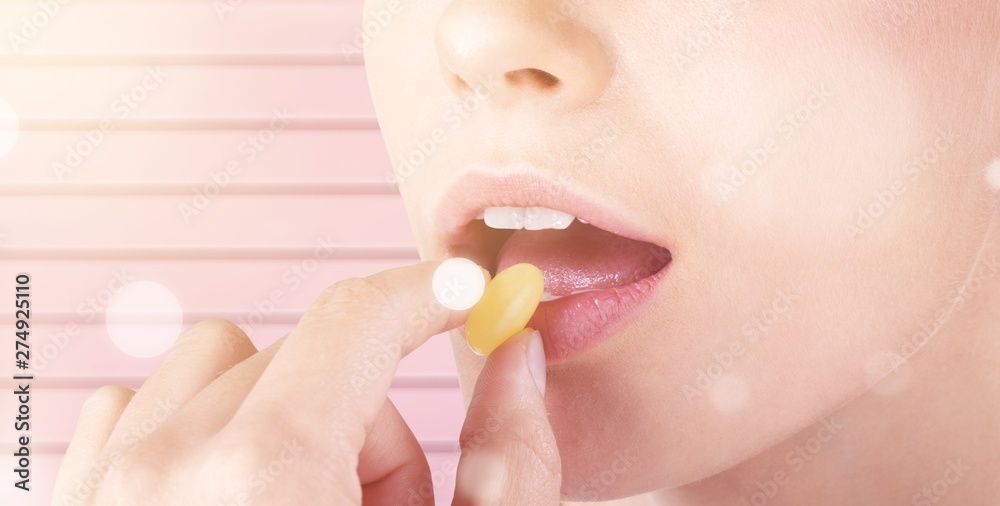 Woman taking pill, close up, healthcare concept Woman taking pill, close up, healthcare concept