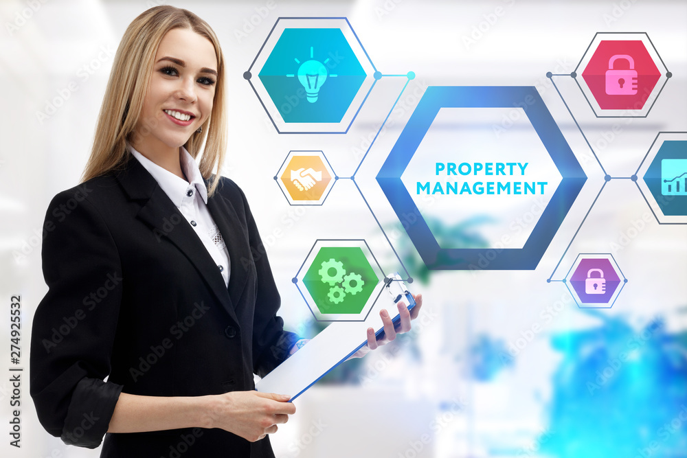 The concept of business, technology, the Internet and the network. A young entrepreneur working on a virtual screen of the future and sees the inscription: Property management The concept of business, technology, the Internet and the network. A young entrepreneur working on a virtual screen of the future and sees the inscription: Property management