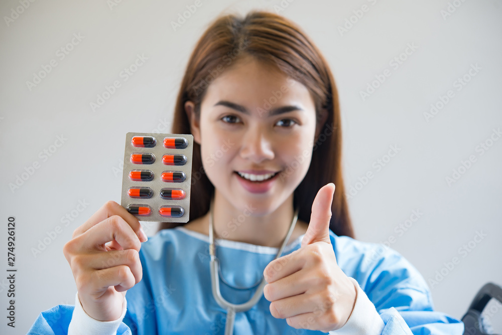 Woman pharmacist holding prescription medicine from doctor order Woman pharmacist holding prescription medicine from doctor order