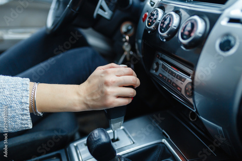 Obraz na plátně Woman switches the automatic transmission's close-up