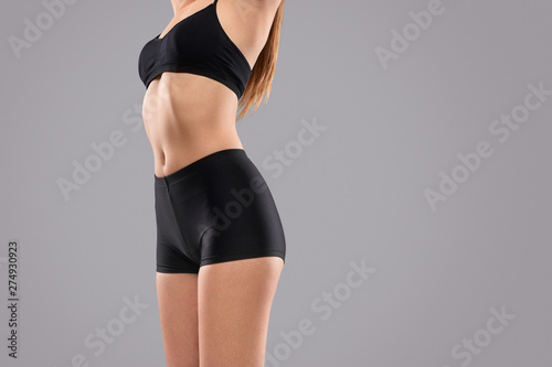 Sporty woman with slim waist