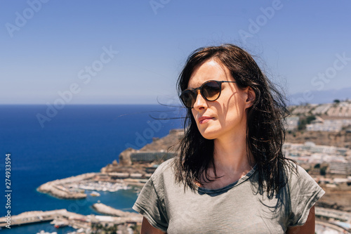 Young woman wearing sunglasses on holidays in Canary Island, Gran Canaria, Spain. © marcinjozwiak