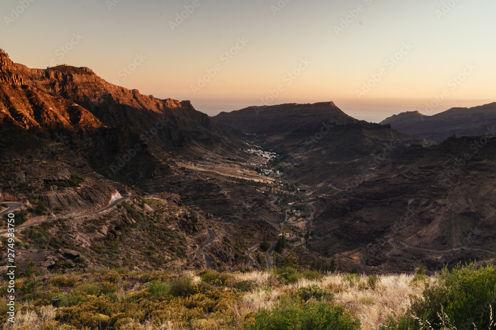 Sun setting over the mountain top in Gran Canaria, Spain. 
