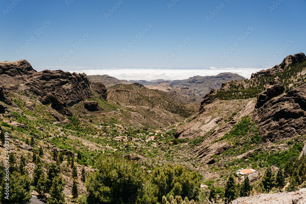 Nature and landscape of the Gran Canaria. Rocky mountains range, valleys, ocean. 