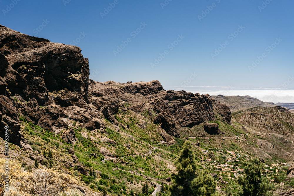 Nature and landscape of the Gran Canaria. Rocky mountains range, valleys, ocean. 