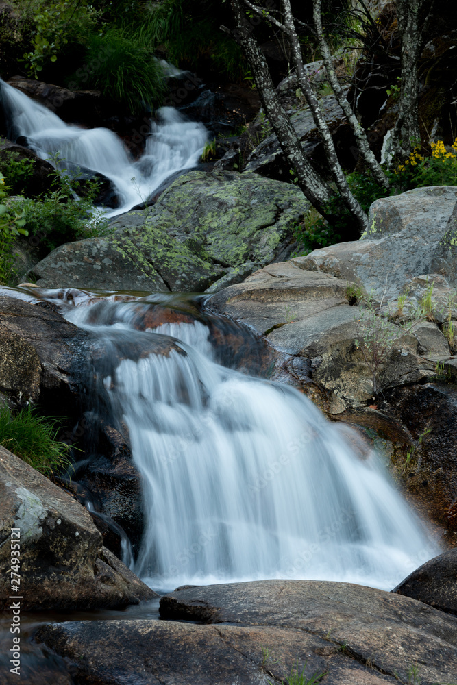 Naklejka premium Beautiful waterfall and big rocks