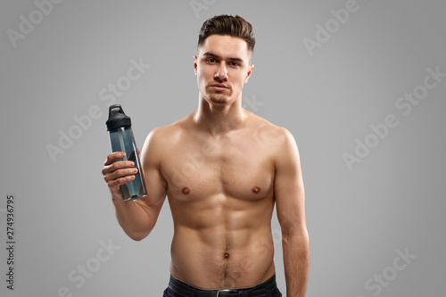 Fit man with bottle of water