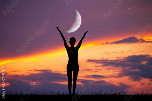 girl silhouette at sunset with moon
