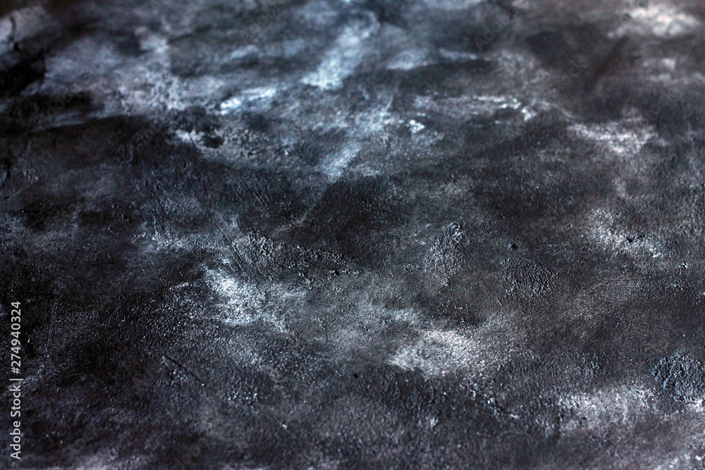 Obraz premium Cracked concrete stone plaster wall background and texture style, black concrete background with white stains.