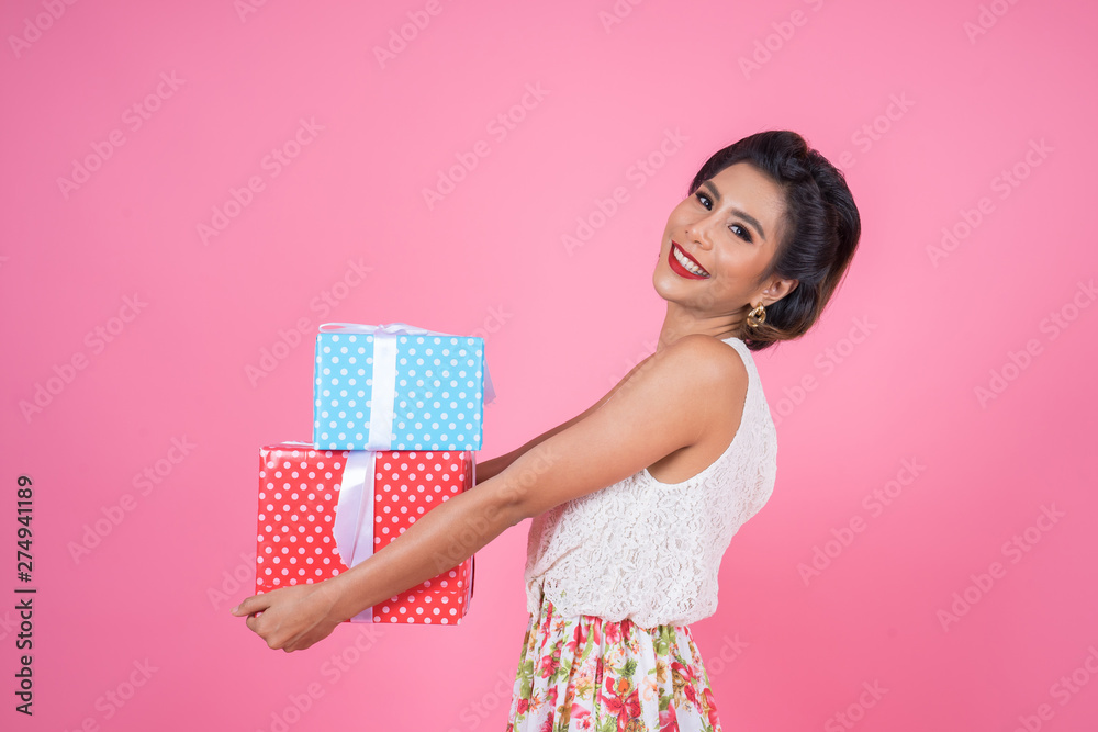 Beautiful happy woman with surprise gift box Beautiful happy woman with surprise gift box