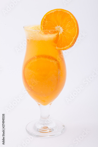 Cocktail glass of orange juice with peaces of orange inside
