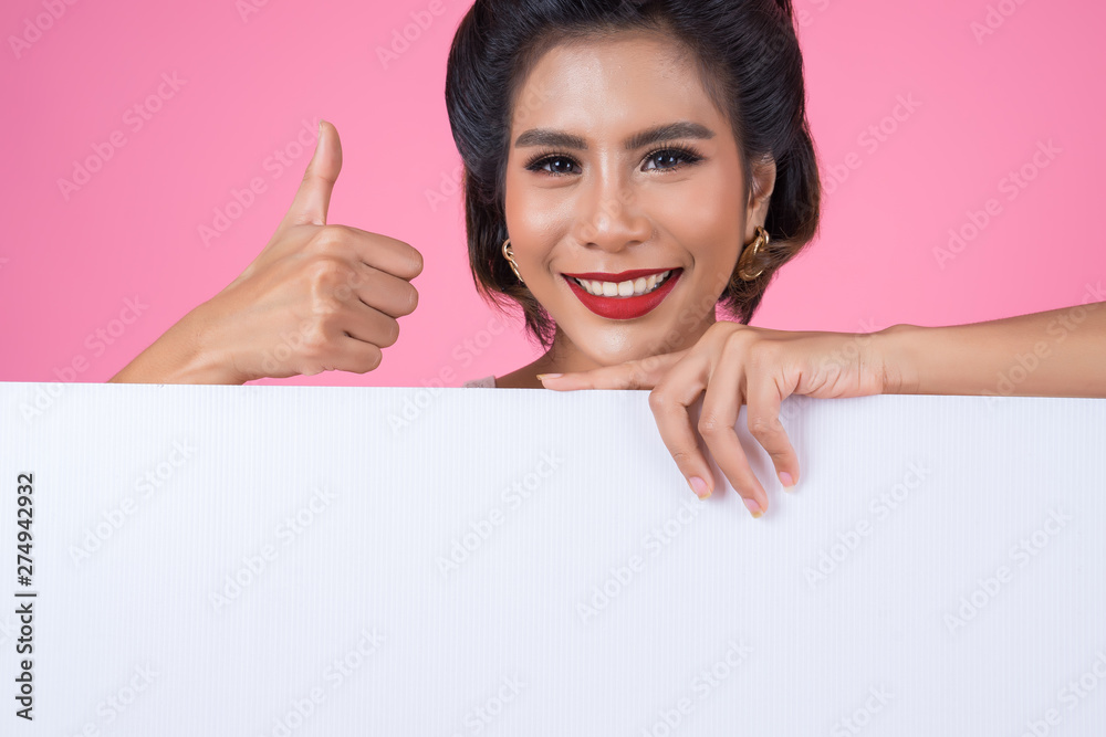 Portrait of fashion woman displaying white banner Portrait of fashion woman displaying white banner