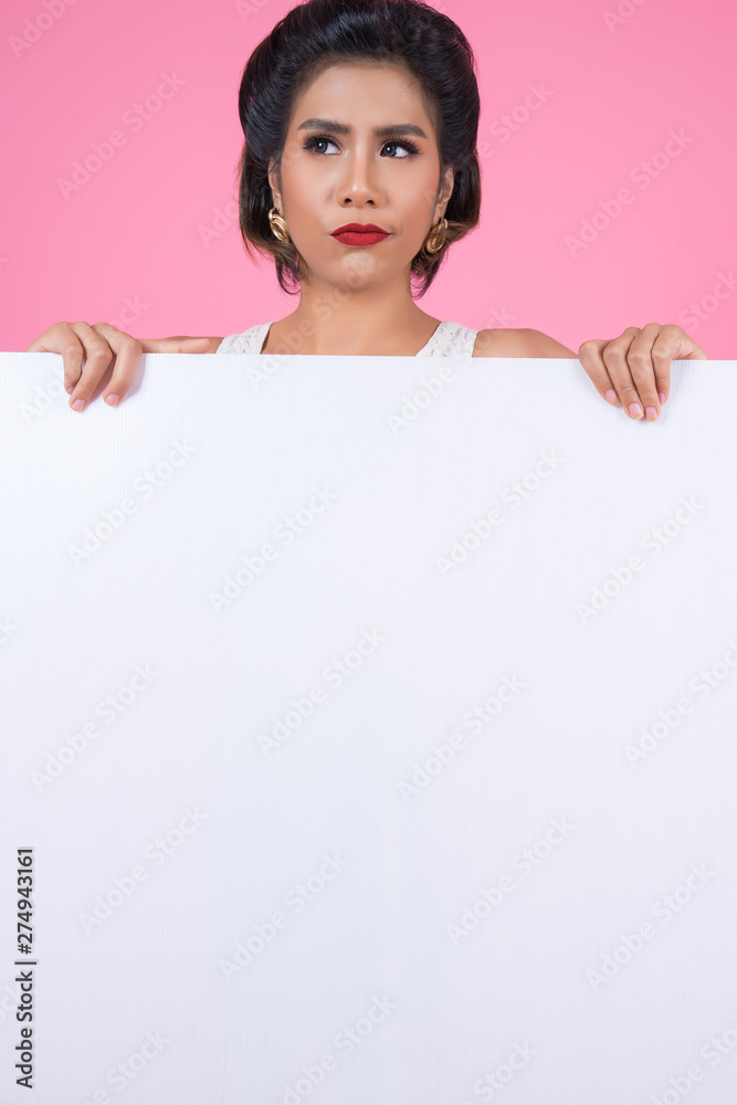 Portrait of fashion woman displaying white banner Portrait of fashion woman displaying white banner