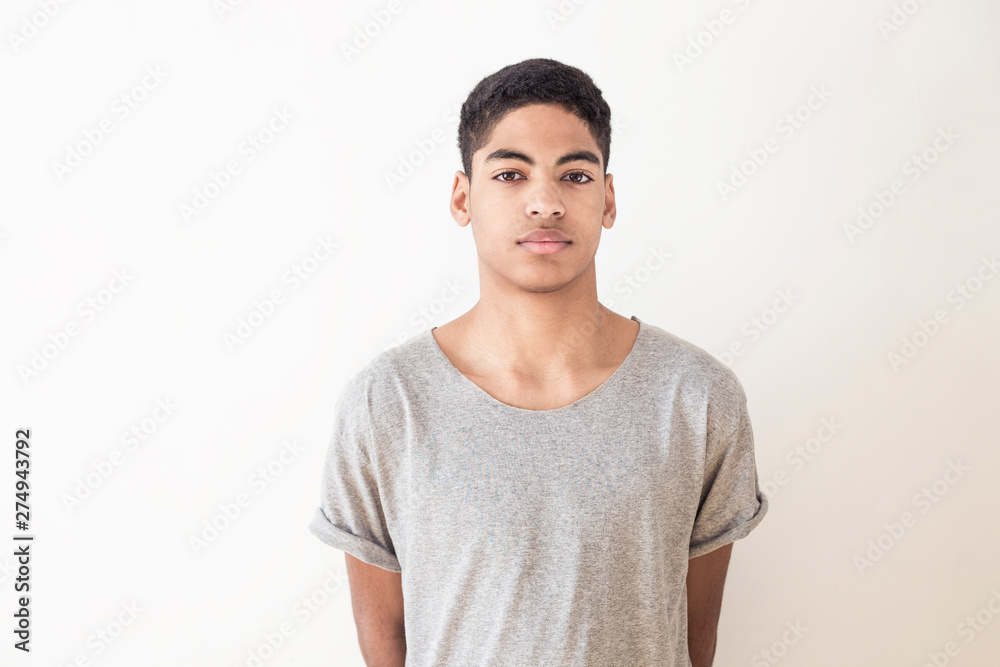 Portrait of a beautiful fashion afro american young man. Teenager mixed race black. Portrait of a beautiful fashion afro american young man. Teenager mixed race black.