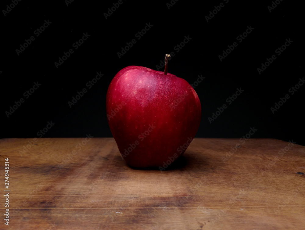 red fresh healthy organic apple on wooden table dark background red fresh healthy organic apple on wooden table dark background