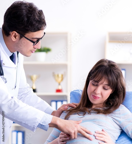 Pregnant woman visiting doctor for consultation