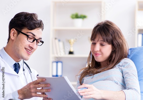 Pregnant woman visiting doctor for consultation