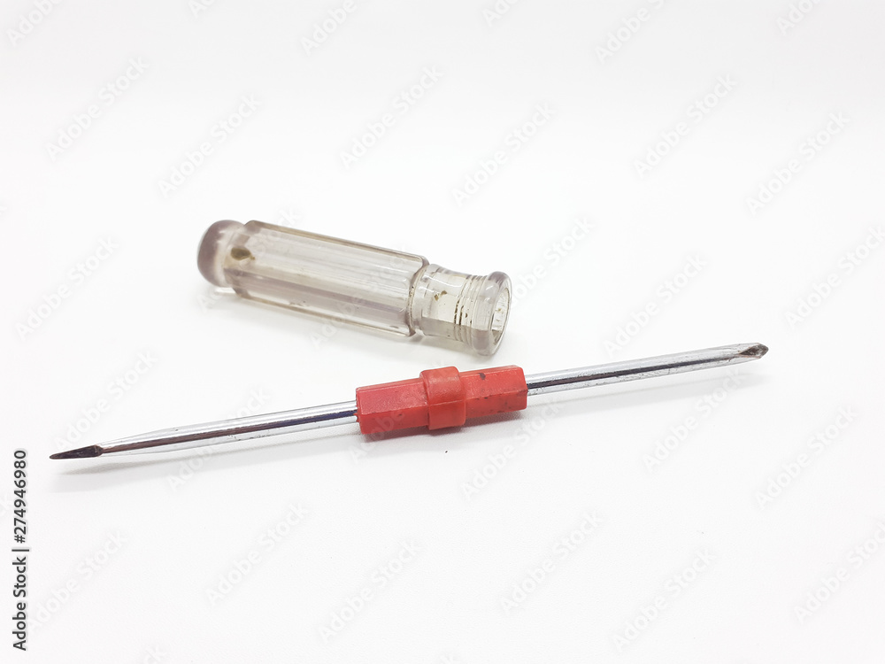 Metallic used rusty screwdriver in White isolated background Metallic used rusty screwdriver in White isolated background