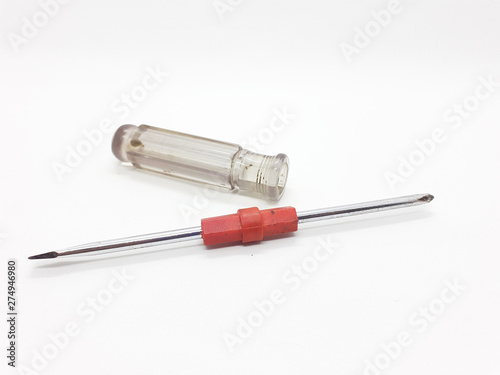Metallic used rusty screwdriver in White isolated background
