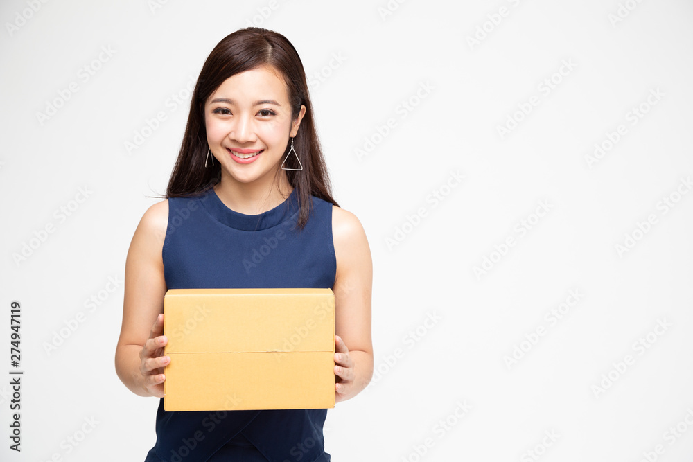 Happy Asian woman holding package parcel box, Delivery courier and shipment service concept Happy Asian woman holding package parcel box, Delivery courier and shipment service concept