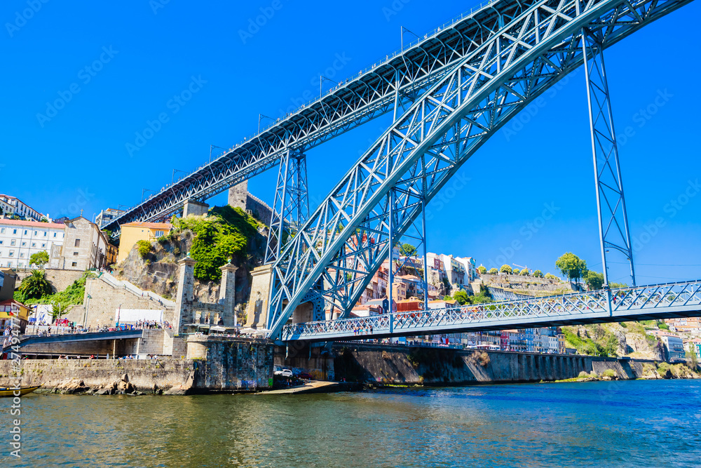 Famous steel bridge dom Luis above connects Old town Porto with Vila Nova de Gaia at river Douro, Portugal.