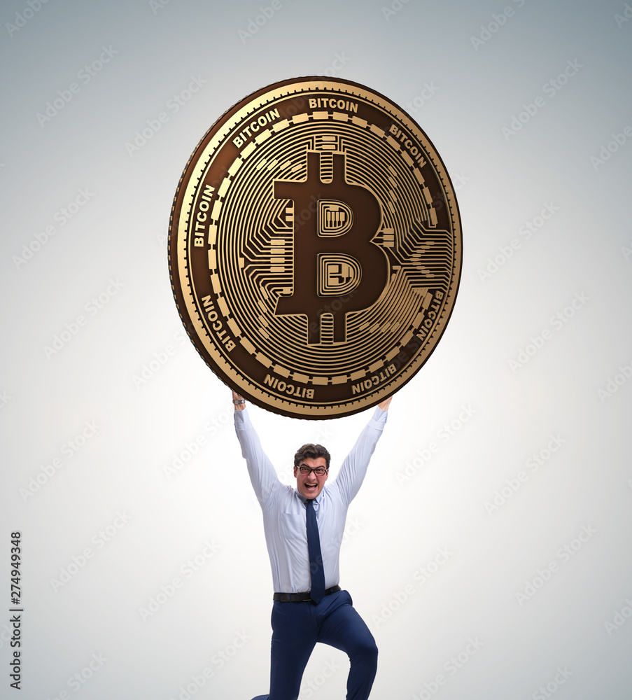 Businessman holding bitcoin in cryptocurrency blockchain concept Businessman holding bitcoin in cryptocurrency blockchain concept
