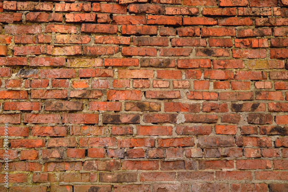 Old brick wall weathered and broken bricks, background Old brick wall weathered and broken bricks, background